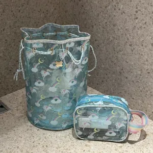 Waterproof PVC transparent bucket cosmetic bag set with cute unicorn rainbow print.