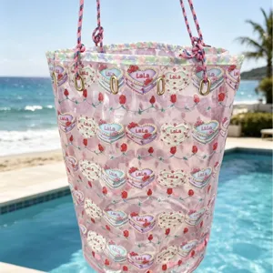 Transparent pink PVC beach tote bag, cute heart pattern waterproof travel handbag for pool.