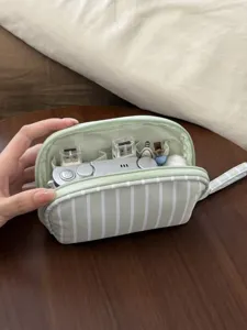 Striped cosmetic bag, large capacity portable travel makeup storage pouch and toiletry bag.