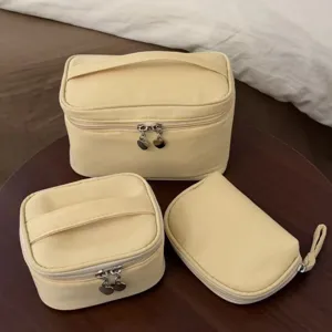 Yellow cosmetic bag set, portable travel makeup organizer, multi-functional toiletry pouch storage.