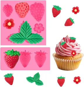 Strawberry silicone mold detail view showing fondant chocolate decorations and cupcake scene.
