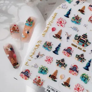 Autocollants d'ongles dorés de style chinois avec pagodes et grues pour une manucure chic.
