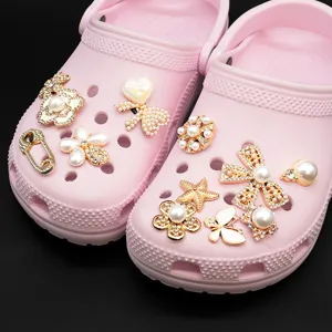 Pink clogs DIY shoe charms set, elegant pearl and rhinestone shoe buckles for stylish footwear.