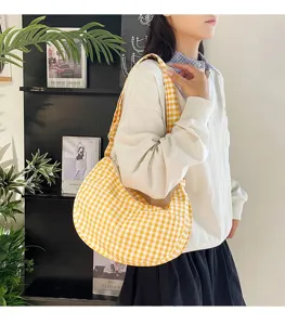 Yellow white plaid shoulder bag, cute dumpling hobo bag for women daily fashion style.