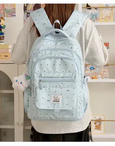 Zaino carino azzurro a pois per la scuola e i viaggi, grande borsa casual per ragazze alla moda.