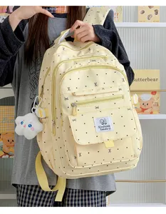 Zaino casual elegante per studenti con grazioso motivo a pois e fiocco, grande capacità.