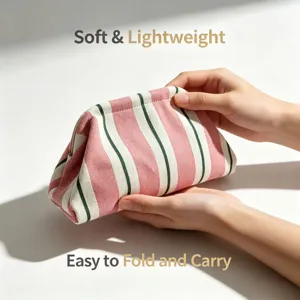 Knitted striped cosmetic bag soft portable clutch pouch with metal frame clasp closure.