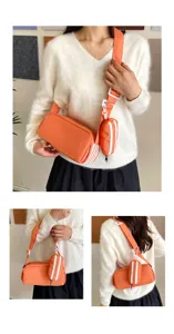Japanse minimalistische cylindrische schoudertas detail met het oranje stoffen ontwerp.