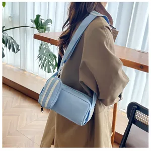 Casual lichtblauwe cilindrische schoudertas voor dames met klein tasje stijlvolle canvas tas