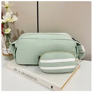 Japans minimalistische crossbody schoudertas met subtas, casual lichtgroene canvas cilindrische tas.