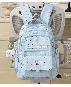 Zaino azzurro a pois e fiocchi per studenti, ideale per viaggi e scuola con stile.