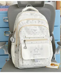 Casual polka dot student backpack with multiple pockets and star patterns for school daily use.