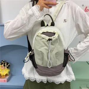 Sac à dos cordon élégant en bloc de couleur, sac de jour décontracté avec poches en filet.