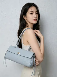 Elegant light blue leather quilted baguette shoulder bag for women, vintage commuting tote.