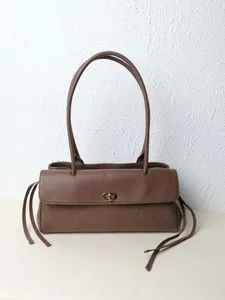 Brown leather shoulder baguette bag, vintage style daily commute handbag with metal twist lock.