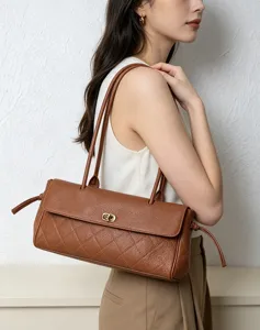 Vintage brown quilted leather baguette shoulder bag for women, elegant commuter underarm handbag.