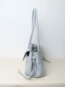 Grey leather shoulder bag for women, large capacity commuter tote with top handles and drawstrings.