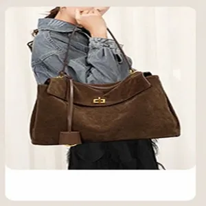 Brown suede shoulder bag for women, elegant fashion tote handbag with metal turn lock closure.