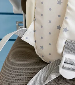 Close up view of the reinforced shoulder strap detail with cute star and dot pattern.
