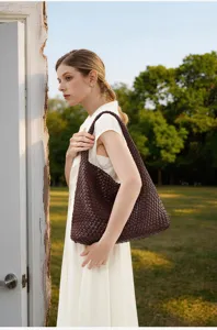 Detailed view of the dark brown woven leather shoulder bag, stylish underarm tote style.