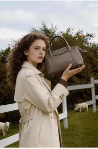 Detailed view of the genuine cowhide pillow handbag, featuring large capacity and elegant style.