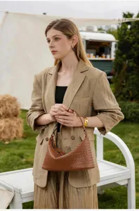 Handmade genuine leather woven underarm bag, stylish brown shoulder handbag for women's daily wear.