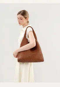 Detailed view of the brown woven shoulder tote bag, ideal for casual seaside vacation and daily wear.
