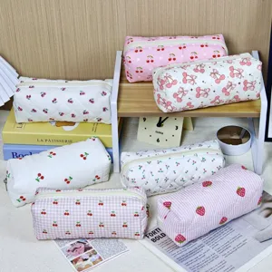 Cute quilted fabric cosmetic bag and cherry strawberry print pencil case for storage.