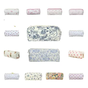 Quilted makeup pouch and cute pencil case with various floral and bow prints for daily use.