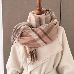 Detailed view of winter plaid fringe scarf texture close up warm wool feel fabric