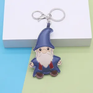 Cute leather gnome keychain pendant, cartoon bag accessory and key ring holder for decoration.