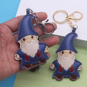 Cute leather gnome keychain pendant, cartoon dwarf bag charm for keys and holiday gifts.