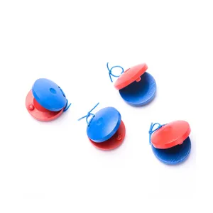 Wooden castanets detail view, colorful Orff percussion instrument for kids musical early learning.