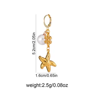 Gold starfish earring detail shot, featuring pearl and snowflake charm with size dimensions.