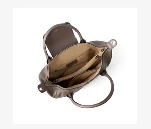 Genuine leather top handle bag detail view, showing interior compartments and zipper pocket.