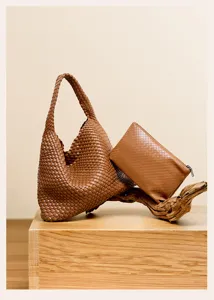 Brown woven leather hobo shoulder bag and matching pouch with classic handmade design details.