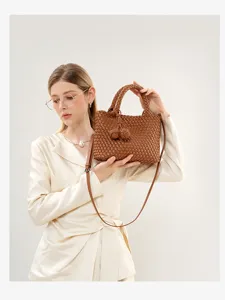 Brown woven leather handbag with a stylish knot handle, perfect for casual and commuting.
