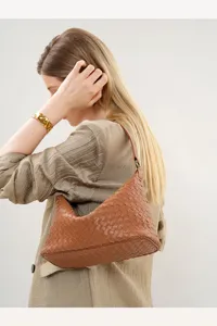 Brown leather woven shoulder bag, elegant hobo bag with premium handcrafted intrecciato design.