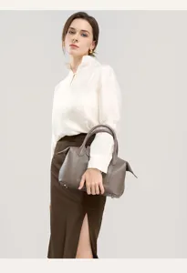 Genuine cowhide leather shoulder bag detail shot, elegant grey tote bag for daily fashion wear.
