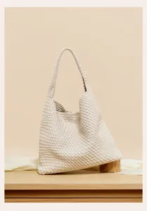 Exquisite woven leather detail showcasing fine craftsmanship, premium texture, and chic style.