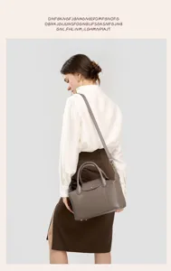 Elegant genuine leather top-handle shoulder bag with chic design, premium quality daily purse for women.