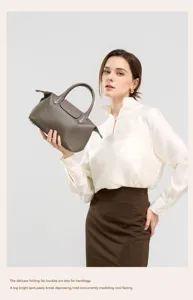 Genuine leather handbag for women, top layer cowhide shoulder bag with classic folding design.