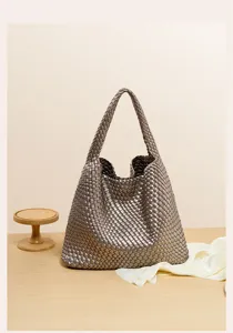 Woven shoulder bag for women, stylish leather-look tote handbag for daily casual chic wear.