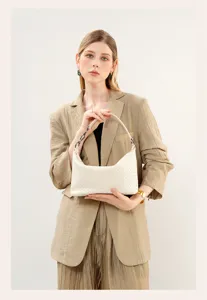 Woven leather shoulder bag for women, elegant hobo handbag with premium handmade design.