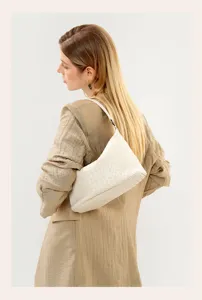 Elegant cream leather woven shoulder bag for women, chic hobo style daily purse.