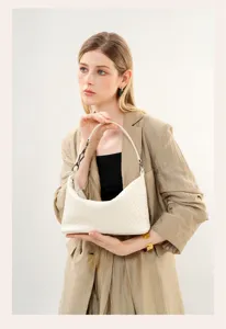 Woven leather shoulder bag for women, elegant hobo handbag with chic chain detail, beige color.