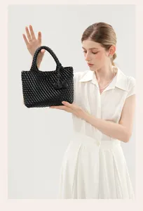 Handcrafted black woven leather small tote bag casual minimalist handbag for women daily commuting.
