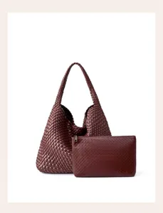 Detailed view of luxury woven leather hobo shoulder bag with matching pouch for women.