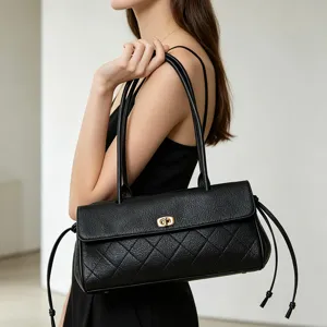 Black leather quilted baguette shoulder bag for women, classic underarm handbag with straps.