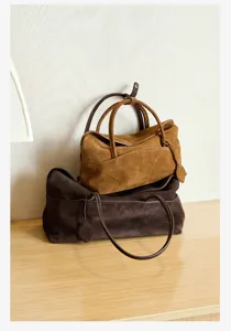 Detailed view of women's autumn winter vintage suede pillow shoulder and tote bag.